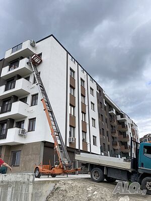 Услуги с мобилен хаспел, товарен асансьор повдигач.