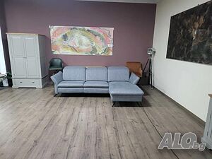 Сив ъглов диван от плат ”HUKLA Interliving” с ел. релакс механизъм