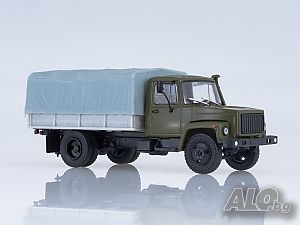 ГАЗ 3309 Бордови с тента 1995 - мащаб 1:43 на Наши Грузовики модела е нов в кутия GAZ