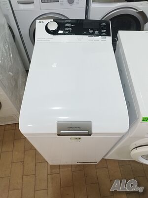 Пералня с горно зареждане AEG