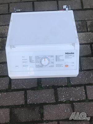Горен капак за пералня Miele W 605 F с горно зареждане.