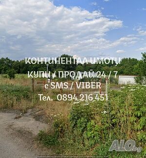 Парцел 2030м2. с лице 50м на главния път с вода, електричество и сонда